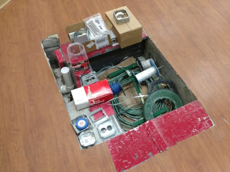 Recessed floor electrical box with cables and electrical wiring components to connect the Varian Edge radiosurgery machine to power and data
