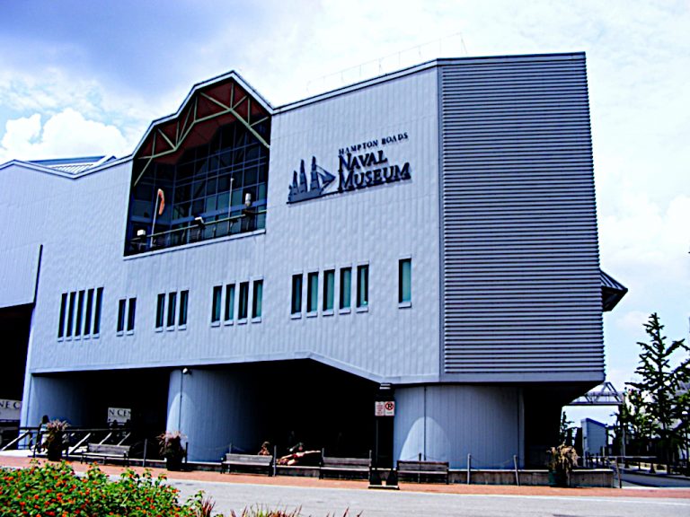 Large modern building with rectangular windows over top of the front entrance to Nauticus which is the Hampton Roads Naval Heritage Museum