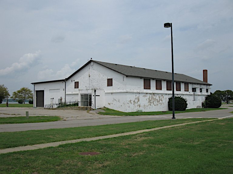 View from across the street of the nostalgic barn wood and brick building prior to the brewery renovation