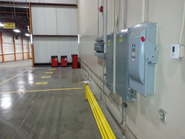 Wall mounted electrical panels and power switch including conduits at the loading entrance of the Stihl building