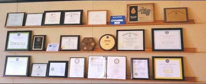 Wall of certificates and degrees in the Vansant & Gusler Inc. lobby