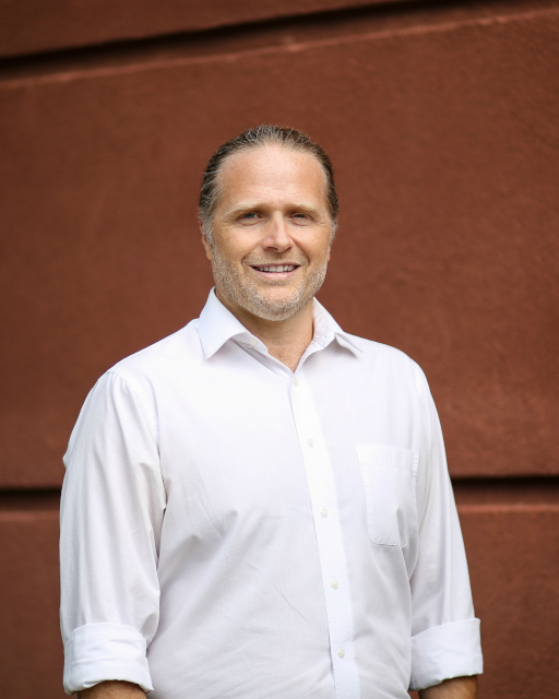 A Vansant & Gusler engineering professional wearing a button down shirt