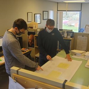 Professional employees exchanging design ideas