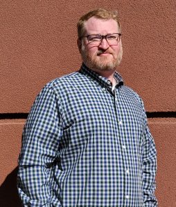 A Vansant & Gusler engineering professional wearing a button down shirt