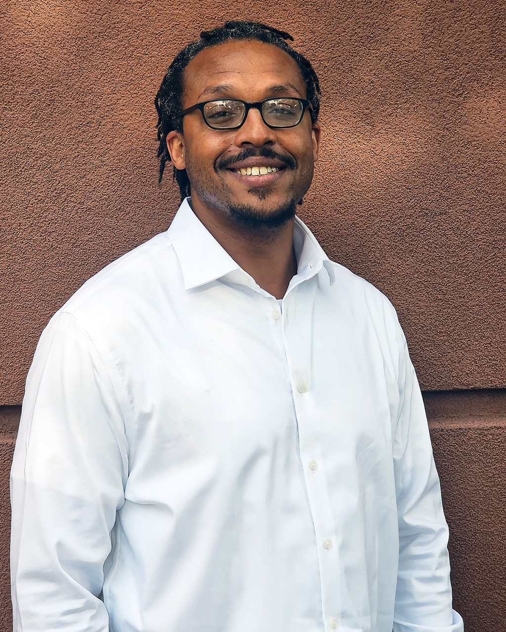 A Vansant & Gusler engineering professional wearing a button down shirt