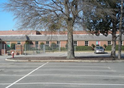 View from the parking lot of the brick building that houses the city water and sanitary utility maintenance facility for Virginia Beach