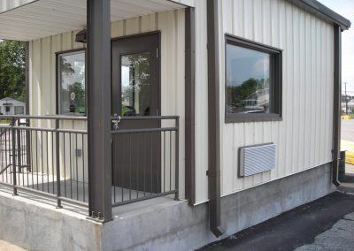 Metal gate house with railings and observation windows newly constructed at Main Gate 15 providing access to Norfok Naval Shipyard