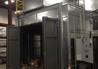 Stainless steel paint sanding booth with double doors at Hangar 2 of the USCG Base in Elizabeth City, North Carolina