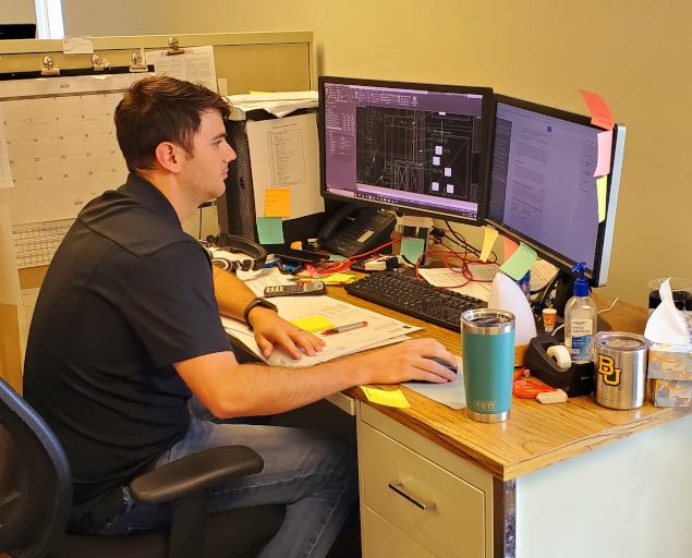 A Vansant & Gusler engineering professional sitting at his desk using a computer