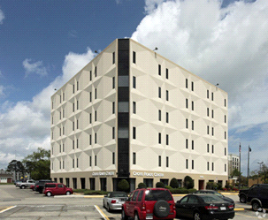 The outside corner view of the entire white modern Vansant & Gusler, Inc office building