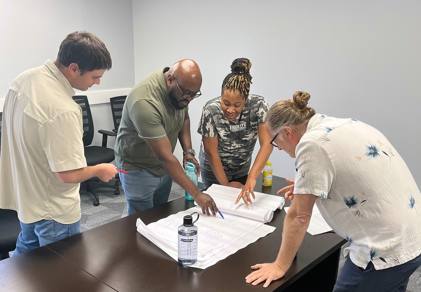 vansant-gusler-professional-employees-discussing-floorplans vansant-gusler-professional-employees-discussing-floorplans