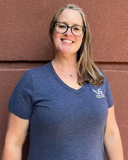 Female casual employee A Vansant & Gusler professional wearing a casual shirt